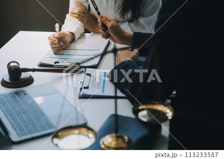Businessman and Male lawyer or judge consult having team meeting with client, Law and Legal services concept. Businessman and Male lawyer or judge consult having team meeting with client, Law and Legal services concept. 113233587