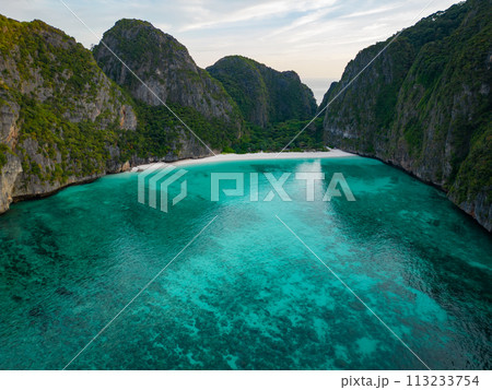 Aerial view of a tropical Maya bay beach with turquoise water and white sand 113233754