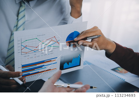 Business team working with new startup project plan and discussion information for financial strategy with laptop and digital tablet in a modern business lounge. 113234693