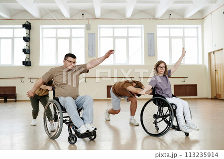 Group four diverse people practicing contemporary wheelchair dance in spacious hall, long shot, copy space Group four diverse people practicing contemporary wheelchair dance in spacious hall, long shot, copy space 113235914