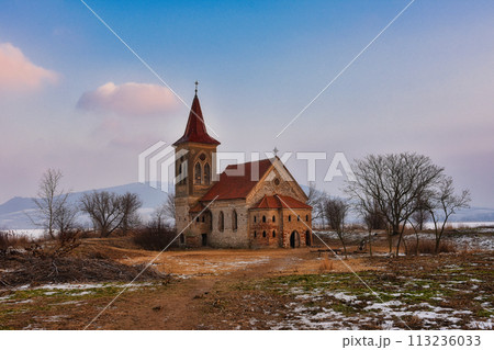 Beautiful old church of St. Linhart. Catholic temple village of Musov - Pasohlavky, Czech Republic. Photo of winter landscape with sunset on a dam New Mills (Nove Mlyny). 113236033