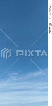 Beautiful view over the blue sky with white clouds 113239523