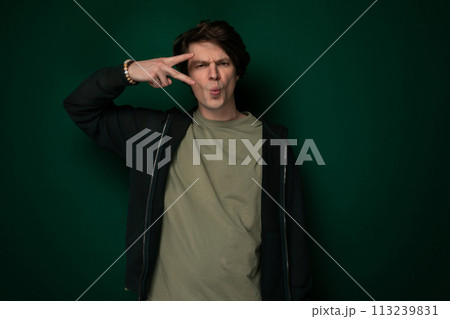 Man Making Silly Face With Fingers Man Making Silly Face With Fingers 113239831