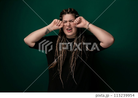 Woman With Dreadlocks Covering Her Eyes Woman With Dreadlocks Covering Her Eyes 113239954