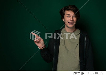 Man in Black Jacket Pointing at Something 113240192