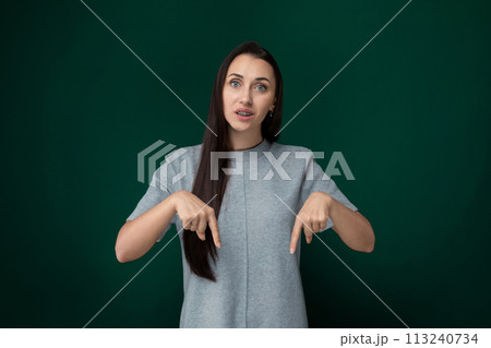 Woman With Long Hair Pointing at Something 113240734