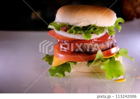 fold a burger create a burger cover with a bun put onion cutlet tomato pour mustard ketchup put cheese and lettuce spread mayonnaise on the bun The whole process in different videos fold a burger create a burger cover with a bun put onion cutlet tomato pour mustard ketchup put cheese and lettuce spread mayonnaise on the bun The whole process in different videos 113242006