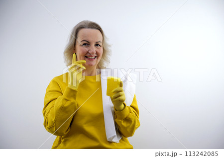 Female janitor with cleaning supplies in kitchen Female janitor with cleaning supplies in kitchen 113242085