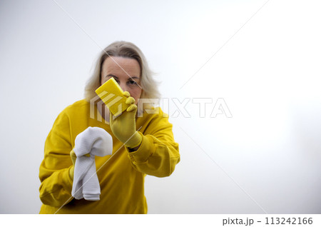 woman looking at the camera isolated background with detergent 113242166
