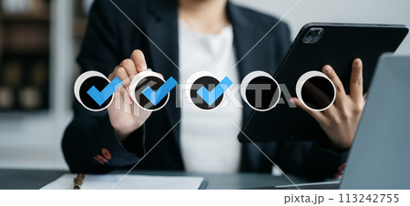 Business performance checklist concept, businessman using tablet and laptop doing online checklist survey, filling out digital form checklist. Business performance checklist concept, businessman using tablet and laptop doing online checklist survey, filling out digital form checklist. 113242755