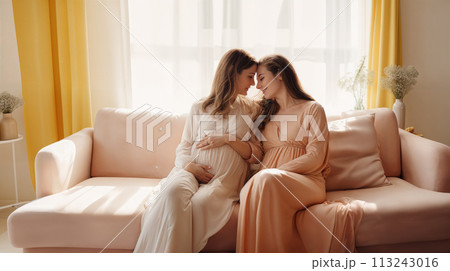 Happy lesbian couple expecting a baby Happy lesbian couple expecting a baby 113243016