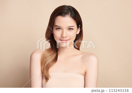 Beautiful young asian woman with clean fresh skin on beige background, Face care, Facial treatment, Cosmetology, beauty and spa, Asian women portrait. Beautiful young asian woman with clean fresh skin on beige background, Face care, Facial treatment, Cosmetology, beauty and spa, Asian women portrait. 113243158