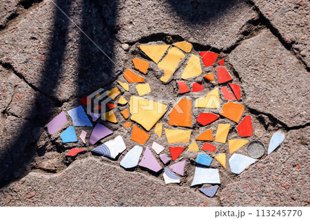 Flooring with broken tiles in pavement pattern, fixing broken roads 113245770