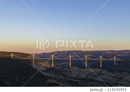Multi-span cable stayed Millau Viaduct across gorge valley of Tarn River, Aveyron Departement, France Multi-span cable stayed Millau Viaduct across gorge valley of Tarn River, Aveyron Departement, France 113245931