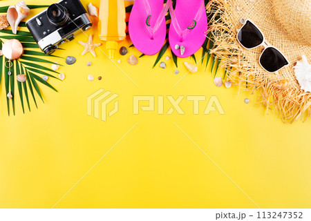 Vacation planning simple theme of chillout attributes - straw hat sunglasses flip flops film camera and palm leaves on uniform yellow background flat lay with copy-space Vacation planning simple theme of chillout attributes - straw hat sunglasses flip flops film camera and palm leaves on uniform yellow background flat lay with copy-space 113247352