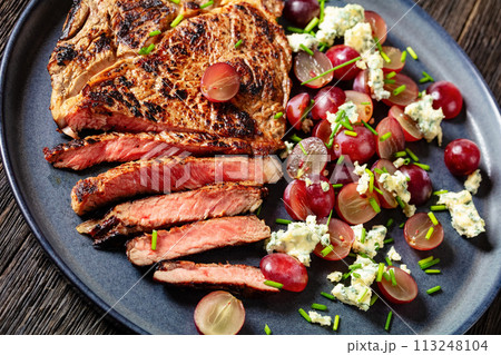 fried beef steak with salad of grape, cheese fried beef steak with salad of grape, cheese 113248104
