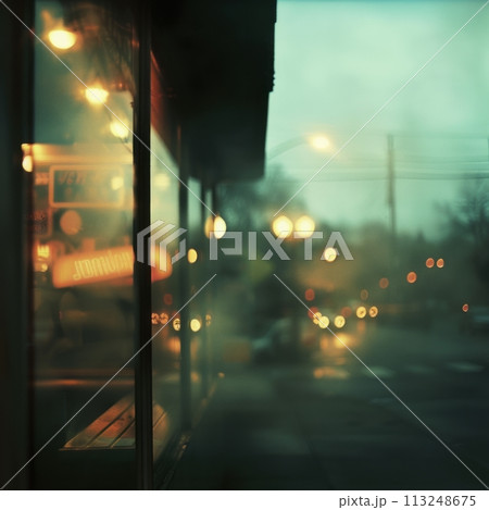 Blurred shop windows from the street in rainy weather, shopping concept in a supermarket Blurred shop windows from the street in rainy weather, shopping concept in a supermarket 113248675