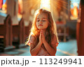 An adorable girl prays in church where Jesus gives rejoicing AI Generation 113249941