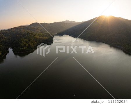 Amazing sunset or sunrise sky over sea lake,Beautiful colorful light of nature sunset background 113252024