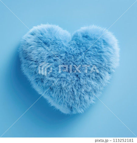 A soft, fluffy heart-shaped cushion in a soothing shade 113252181