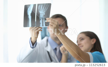 Doctor with colleague in hospital 113252613