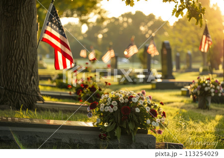 Gravestones with American flags at a cemetery. Gravestones with American flags at a cemetery. 113254029