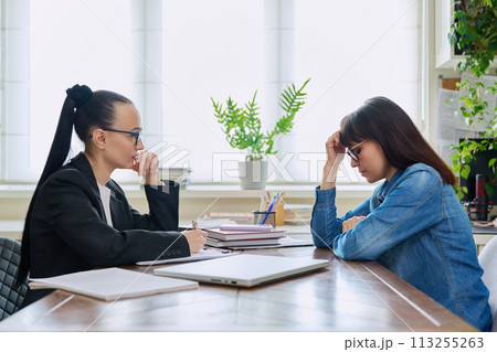 Mental therapy of sad depressed mature female with professional psychologist Mental therapy of sad depressed mature female with professional psychologist 113255263