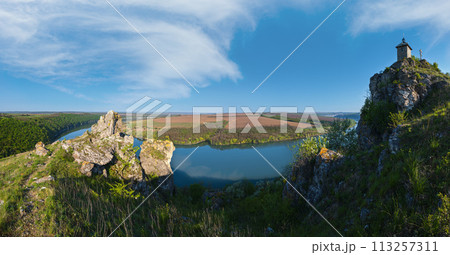 Amazing spring view on the Dnister River Canyon with picturesque rocks, fields, flowers. This place named Shyshkovi Gorby,  Nahoriany, Chernivtsi region, Ukraine. 113257311