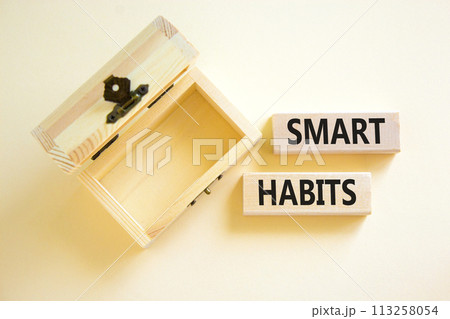 Smart habits symbol. Concept words Smart habits on wooden blocks. Beautiful white table white background. Wooden empthy chest. Business and smart habits concept. Copy space. 113258054