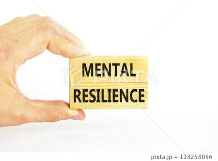 Mental resilience symbol. Concept word Mental resilience typed on wooden blocks. Beautiful white table white background. Doctor hand. Business psychological and mental resilience concept. Copy space. 113258056
