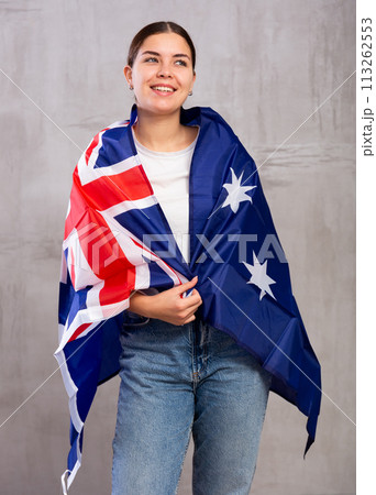 Happy girl stands with flag of Australia .Isolated 113262553