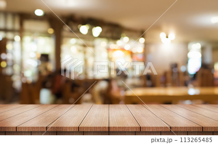 Empty wooden table top with lights bokeh on blur restaurant background.	 113265485