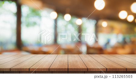 Empty wooden table top with lights bokeh on blur restaurant background.	 113265503
