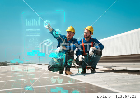 Engineers install solar cells on the roof of factory Engineers install solar cells on the roof of factory 113267323