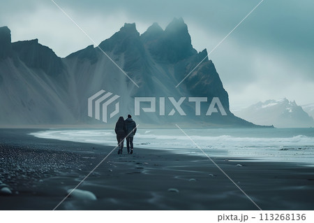 Mountain Magic: Traveling Couple Revels in Breathtaking Views from Iceland's Black Beach 113268136