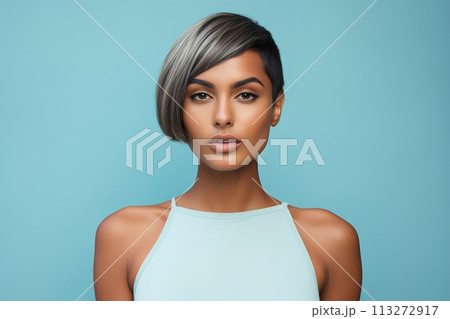 A woman with a short haircut and a blue tank top 113272917