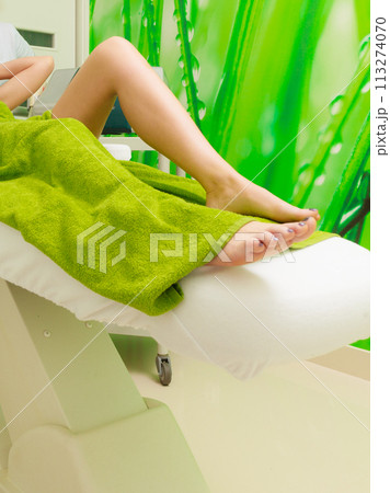 Woman getting laser treatment in beautician Woman getting laser treatment in beautician 113274070