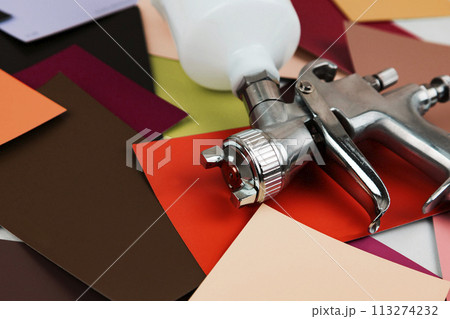 Paint spray gun at work at the workplace in the workshop. Paint Brush Paint spray gun at work at the workplace in the workshop. Paint Brush 113274232