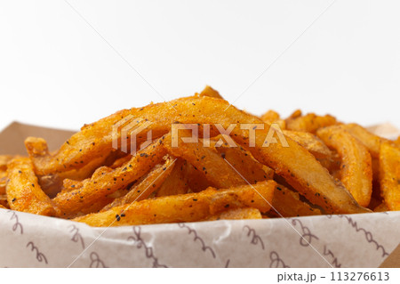 Cajun French fries on a white background 113276613