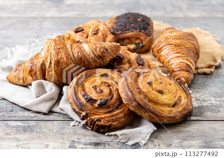 Set of bakery pastries on wooden table 113277492