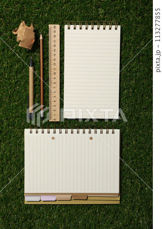 Notebook and stationery on the table, top view. 113277855