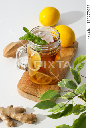 A glass of cold tea with fresh orange slices A glass of cold tea with fresh orange slices 113277928