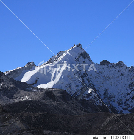 Moraine of the Khumbu Glacier and peak seen from Gorakshep, Nepal. 113278311