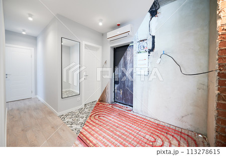 Old apartment with brick walls and new renovated flat with doors, mirror, air conditioner and stylish design in white tones. Inferior of apartment before and after renovation. Old apartment with brick walls and new renovated flat with doors, mirror, air conditioner and stylish design in white tones. Inferior of apartment before and after renovation. 113278615