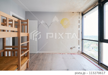 Old apartment room with brick wall and new renovated flat with parquet floor and kid house bed. Comparison of children room with wooden bunk bed before and after renovation. 113278617