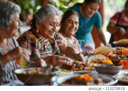 Cinco de Mayo concept - traditional Mexican family dinner with different generations sharing meal 113278618