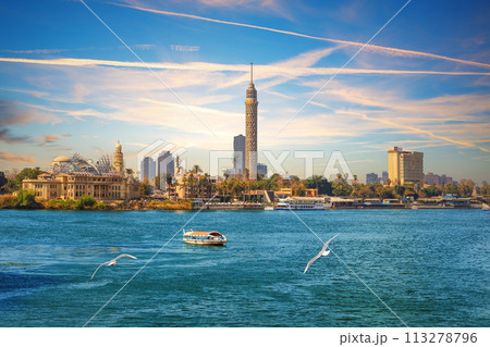 View on the Cairo Tower at sunset in Gezira island in the Nile, Egypt 113278796