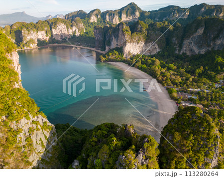 An aerial view of a Railay beach of water surrounded by mountains 113280264