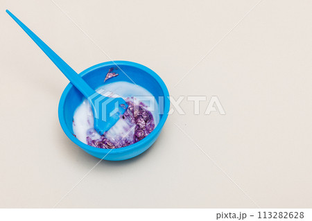 Two plastic bowls with bleach hair dye 113282628