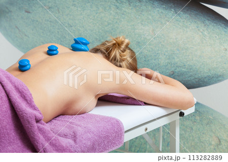 Massage with cupping glass in beautician Massage with cupping glass in beautician 113282889